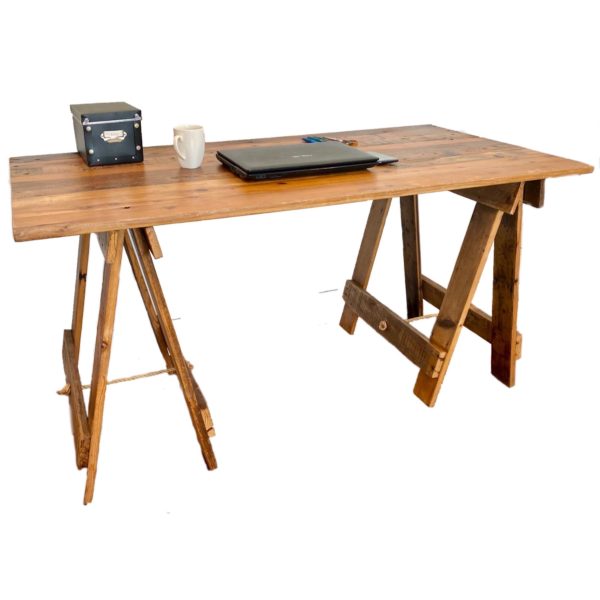 Reclaimed timber desk with laptop, mobile phone and pens on surface and reclaimed hardwood timber trestle legs