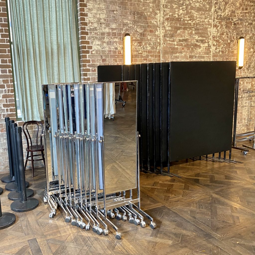 Bollards, mirrors and black partitions in venue