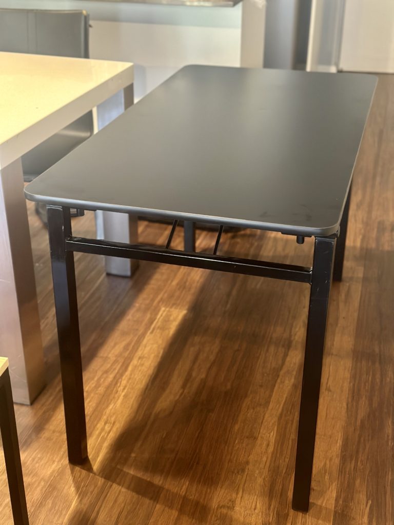 Black dining table extension up against existing dining table